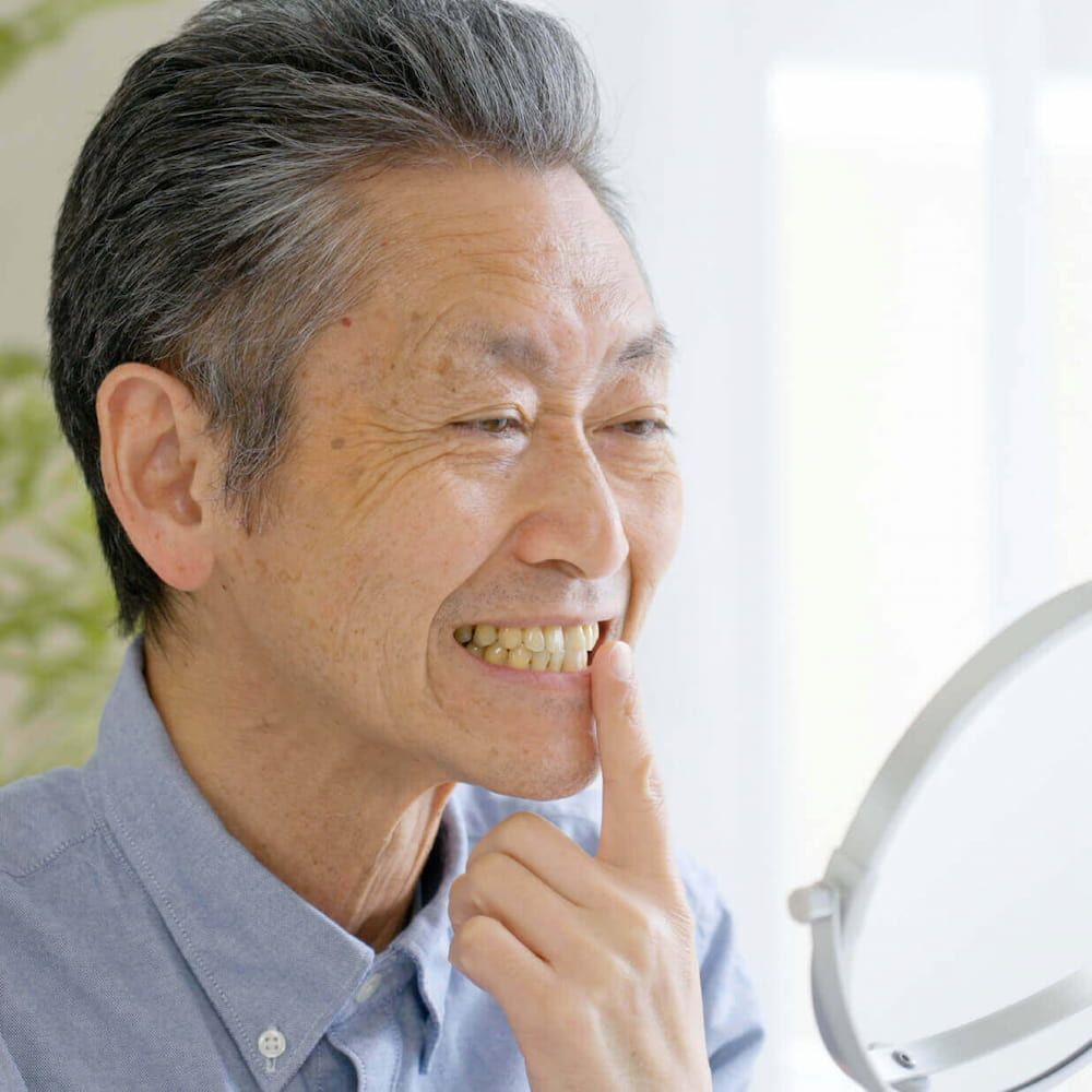 https://kokuasmiles.tradebuilderinc.comAn elderly man with dental bridges | Kokua Smile