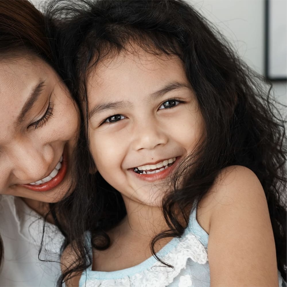 "Image of a mother and daughter receiving dental sealants | Kokua Simle 