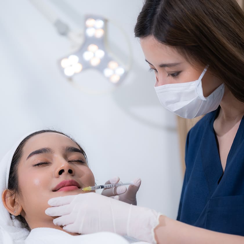 A woman undergoing fillers treatment | Kokua Smile